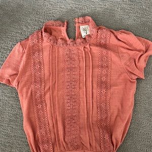 Coral blouse with lace detail